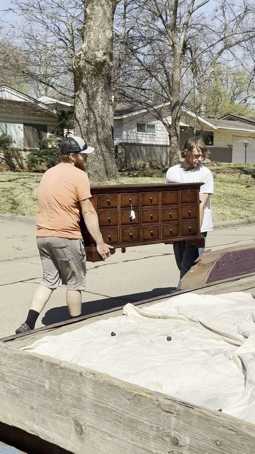 Carrying a dresser across the lawn